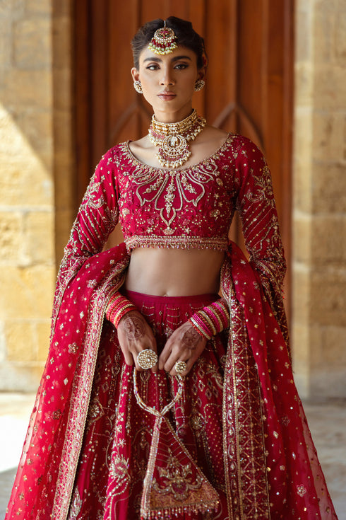 Macro shot of NAQSHI Qurbat lehenga panel showing composed floral motif spread in hand-adda: kora, dabka, sitari, cut-dana, threadwork, and crystal clusters.
